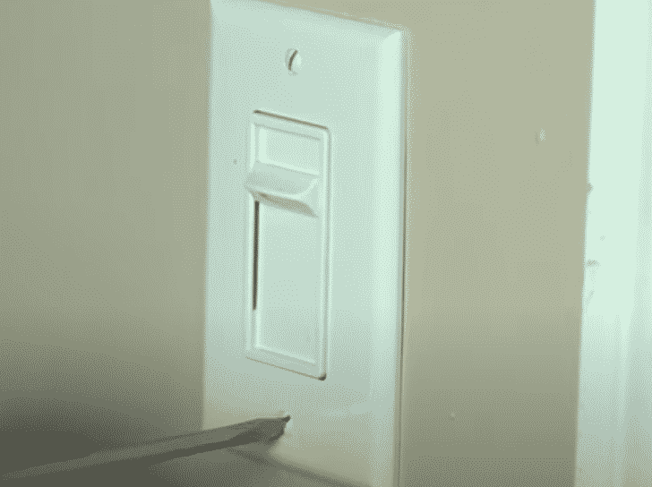 dimmer light switch turns on by itself
