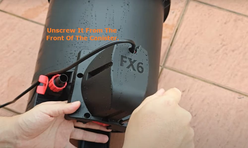 unscrew it from the front of the canister