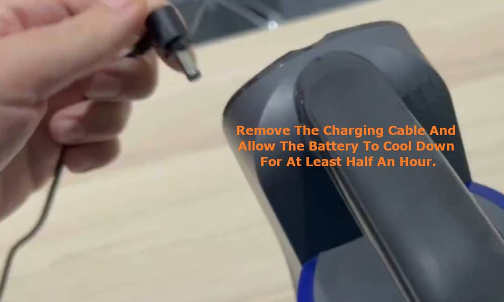 remove the charging cable and allow the battery to cool down for at least half an hour.